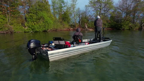 Sunset on Lake Couchiching near Simcoe at spring evening. Anglers in fishin.. Stock Footage 337359732