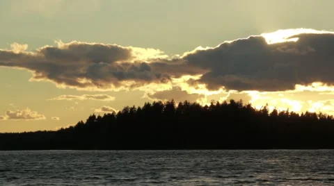 Sunset lake with dark clouds in horizon Stock Footage 54541371