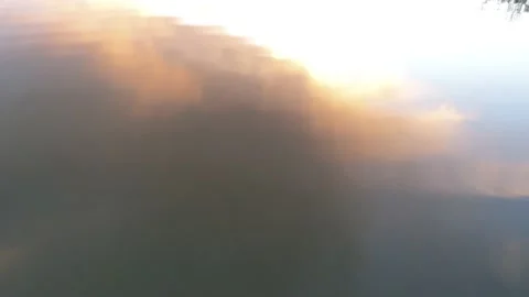 Sunset in lake - Drone camera moves up, forward, down, and back Stock Footage 137864552