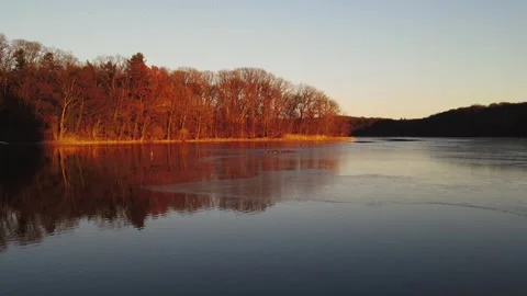 Sunset on the lake. Ducks on the lake in the setting sun. Stock Footage 295069812