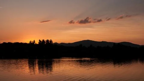 Sunset on lake landscape Stock Photos