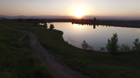 Sunset Lake Launch Birds Over Water 4K Stock Footage 78256494