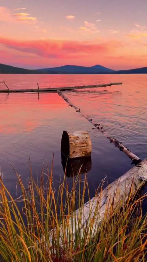 Sunset on the lake with mountains Stock Footage 274691040