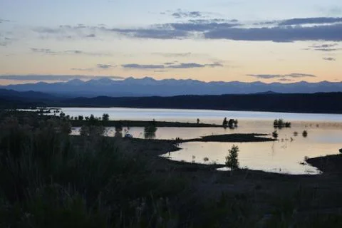 Sunset on Lake with Mountains Stock Photos