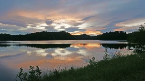 Sunset on a Lake in Norway. Time Lapse UltraHD 2160p 4K. Stock Footage