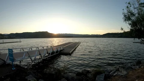 SUNSET IN THE LAKE WITH PEOPLE TIMELAPSE Stock Footage 93568827