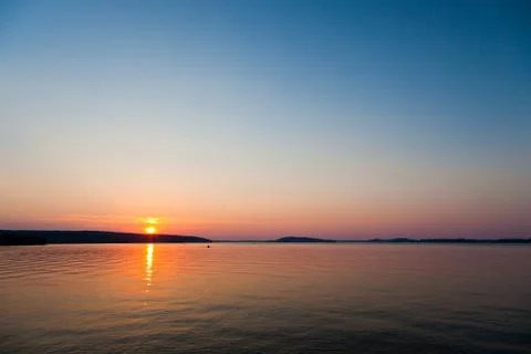 Sunset on a lake Stock Photos