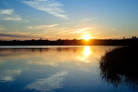 Sunset lake Stock Photos