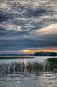 Sunset at a lake Stock Photos