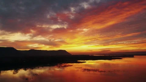 Sunset lake reflection, golden hour sky, peaceful evening landscape Stock Footage 310758176