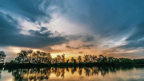 Sunset lake reflections, dramatic sky view, tranquil water scene Stock Footage 311423499