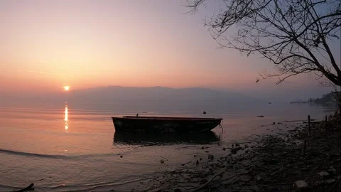Sunset on the lake with rowing boat Stock Footage 261433817