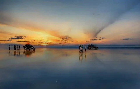 Sunset at lake Salar de Uyuni in Bolivia Stock Photos