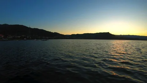 SUNSET IN THE LAKE WITH SHIP Stock Footage 93568834