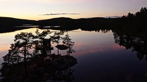 Sunset at a lake with an small island Stock Footage 267622809