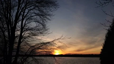 Sunset at a lake with trees, 6:45PM 動画素材 130544334