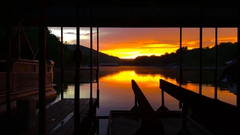 Sunset at lake view from boat dock - dollying to the left Stock Footage 99368548