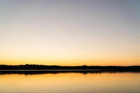 Sunset on the lake in the wilderness Stock Photos