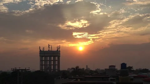 Sunset Landscape with clouds and a bird flying before setting sun Stock Footage 255309441