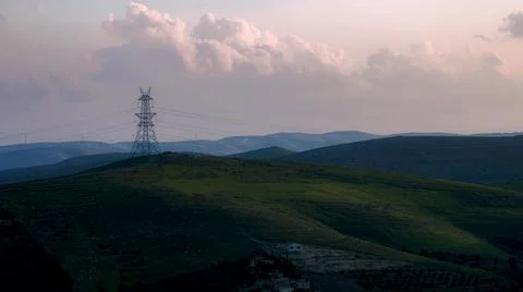 Sunset landscape for electric clouds and mounds 스톡 사진