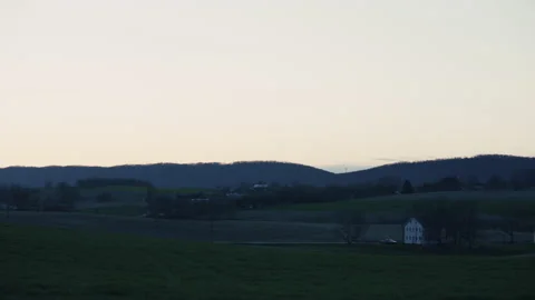 Sunset landscape of a Field in a rural setting Stock Footage 276380560