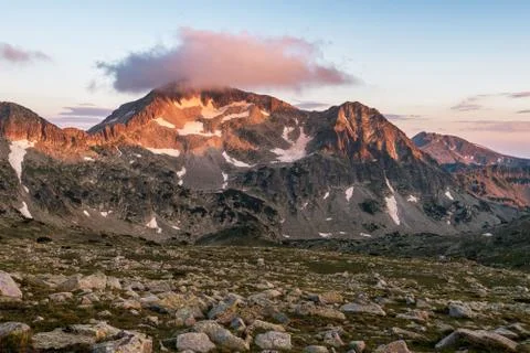 Sunset landscape with Kamenitsa peak and Tevno lake. Stock Photos