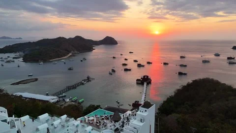Sunset landscape in Labuan Bajo featuring a luxury resort pool Stock Footage 341170704
