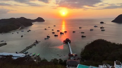 Sunset landscape in Labuan Bajo featuring a luxury resort pool Stock Footage 341171934