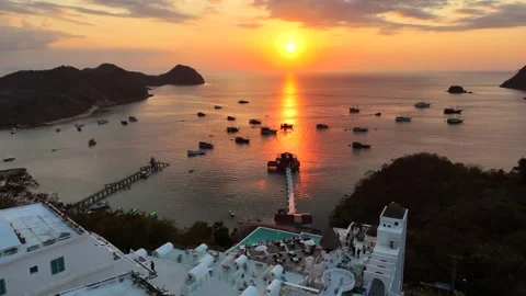 Sunset landscape in Labuan Bajo featuring a luxury resort pool Stock Footage 341171976