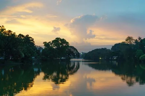 Sunset landscape at lake with reflection of trees in Kandy in Sri lanka Stock Photos