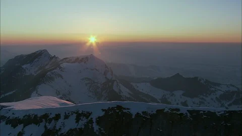 Sunset landscape of mountain peak with snow, The Alps At Sunset V Red Sun Over Stock Footage 108601589