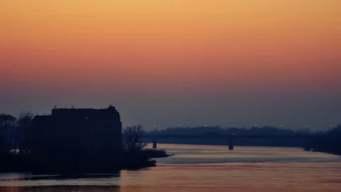Sunset landscape of river with bridge on the horizon  Stock-Footage 70299273