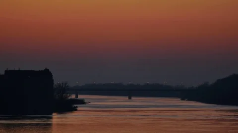 Sunset landscape of river with bridge on the horizon  Video stock 70308093