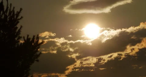 Sunset with Large Orange Glowing Sun with Clouds 10bit, 4K Stock Footage 65566370