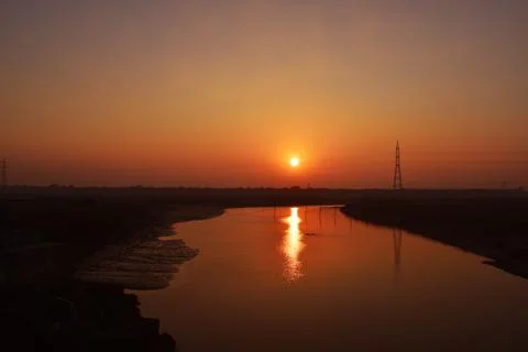 Sunset with a large river Stock Photos