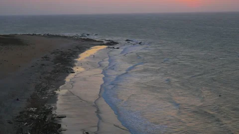 Sunset on a large sandy beach by the ocean in Jericoacoara, Brazil Stock Footage 231555145