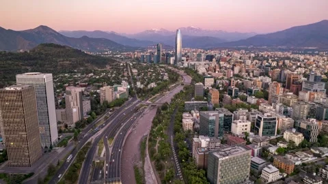 Sunset lateral drone rise over Mapocho River and Costanera Center Stock Footage 310960568
