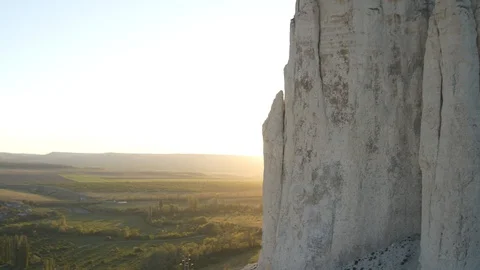 Sunset light behind a white rock Stock Footage 91402557