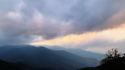 Sunset Light Breaking Through Dark Clouds Over Mountain Ridges Tibet China T 库存影片 333499544