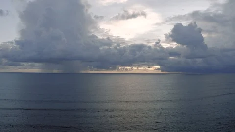 Sunset light in Clouds and Ocean next to Bali Island 4K Drone shot Stock Footage 119343781