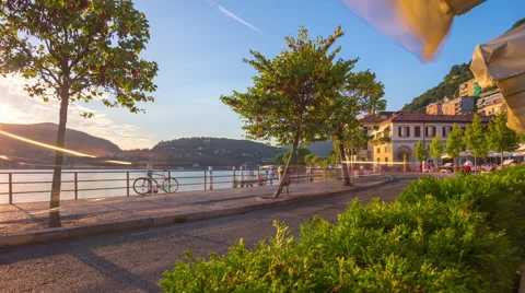 Sunset light famous como lake restaurant bay panorama 4k time lapse italy Stock Footage 68889230