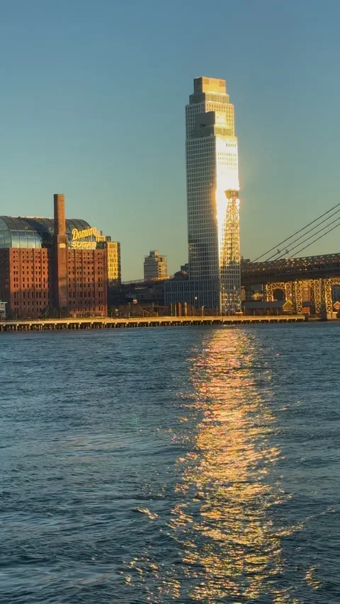 Sunset light illuminates high-rise buildings at Williamsburg in Brooklyn in NYC 動画素材 315145881