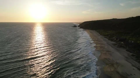 Sunset Light Illuminating Gentle Ocean Waves on Empty Sand Stock Footage 321707880