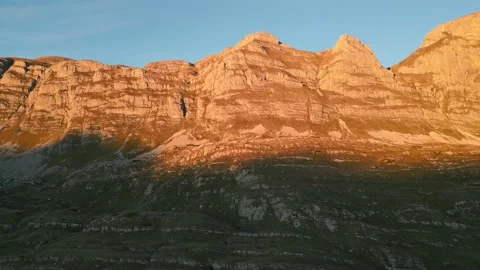 Sunset light on a mountain ridge, red peak of mountain Stock Footage 232273343