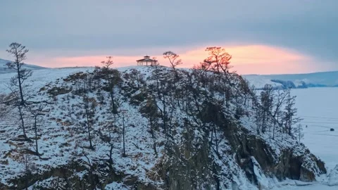 Sunset light over the icy wastelands of the frozen Lake Baikal. In the Stock Footage 228883343