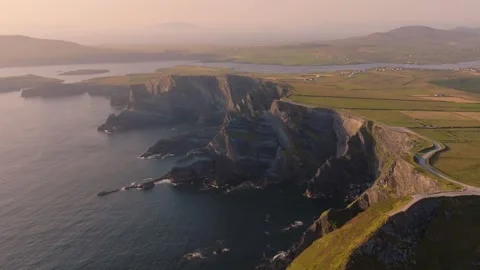 Sunset Light Over Kerry Cliffs And Patchwork Fields, Aerial Fly Past Stock Footage 343726328