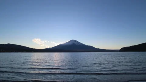 Sunset light over Mount Fuji from lake Yamanaka, Yamanashi Prefecture, Japan Stock Footage 151433397