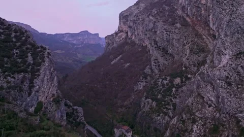 Sunset light over Pont-en-Royans village with mountain backdrop Stock Footage 306797205