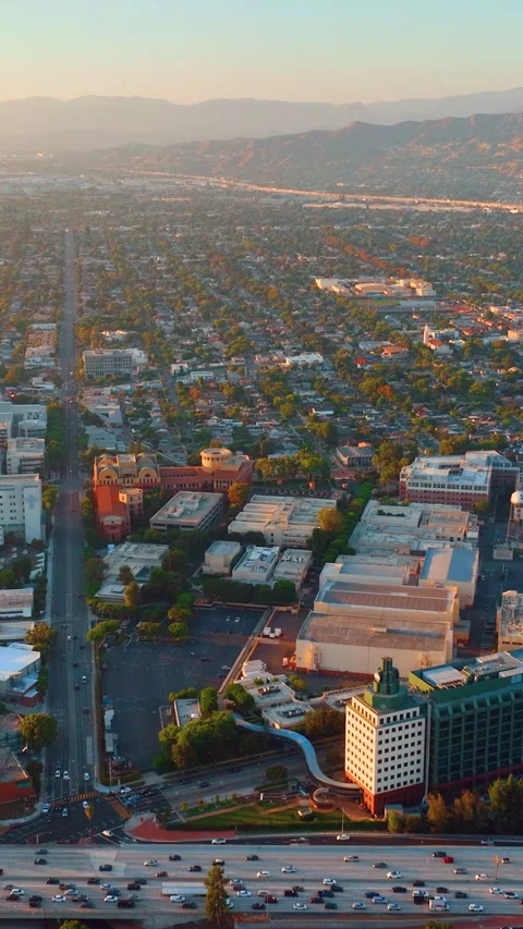 Sunset light over urban valley neighborhood, California, Los Angeles Vertical Video stock 342273050