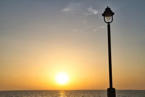 The Sunset with a Light Post 写真素材